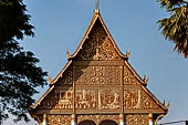 Vientiane, Laos - Pha That Luang, the elegant structure, Wat That Luang Neua, with a very ornate front faade fronted by two tall standing Buddha statues. 